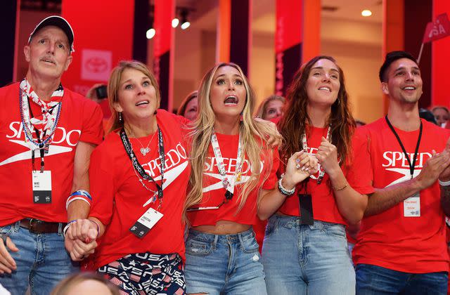 Julio Aguilar/Getty Caeleb Dressel’s wife, Meghan Dressel, and his family watch him during the Tokyo 2020 Olympic Games in July 2021 in Orlando, Florida.