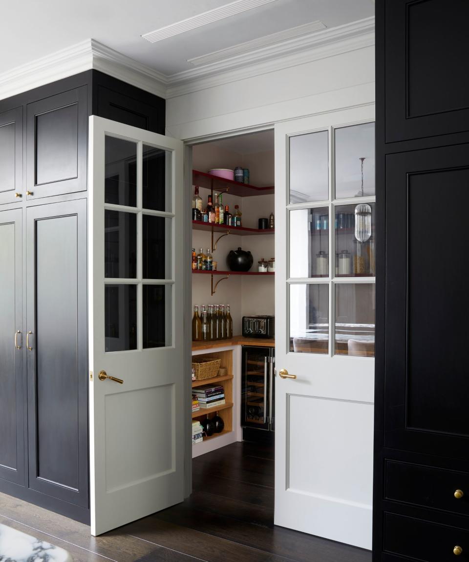 Kitchen pantry, wooden shelves, white and black base cabinets