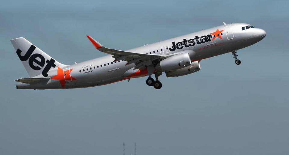 Jetstar plane in flight as workers announce plans to strike ahead of the Christmas period. 