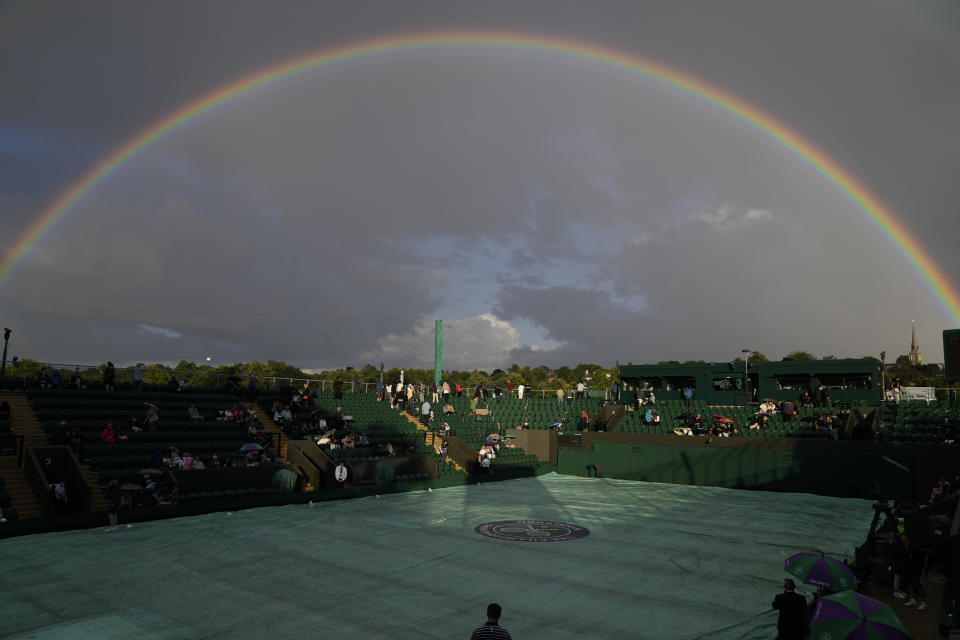 A view of a rainbow over a court on day four of the Wimbledon tennis championships in London, Thursday, June 30, 2022. (AP Photo/Alastair Grant)