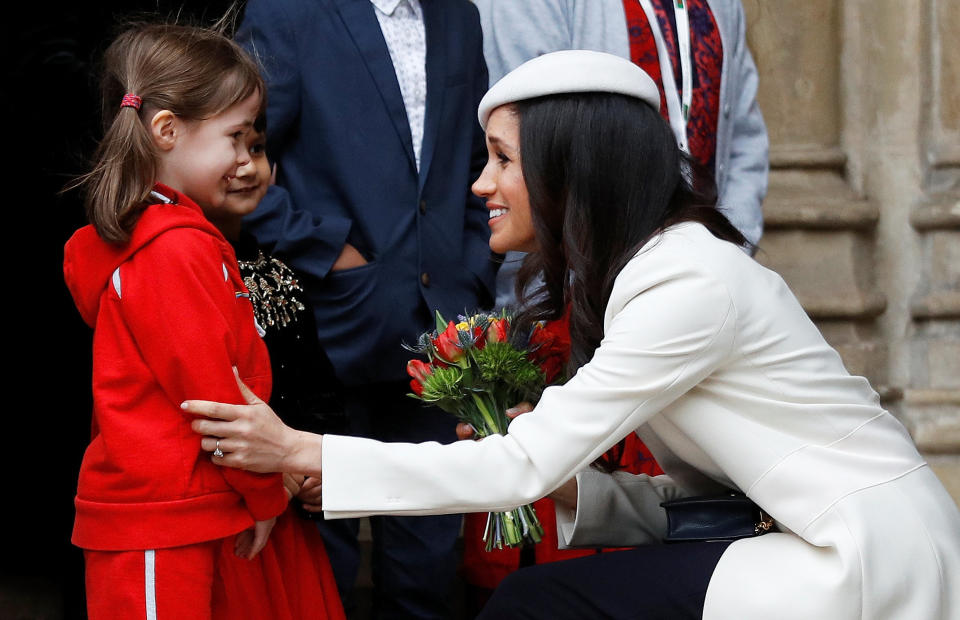 Greeting schoolchildren after the Commonwealth service. (Photo: Peter Nicholls / Reuters)