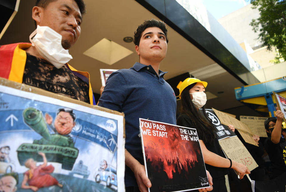Former University of Queensland student and activist Drew Pavlou and others protest in support of Hong Kong in Brisbane. Source: AAP
