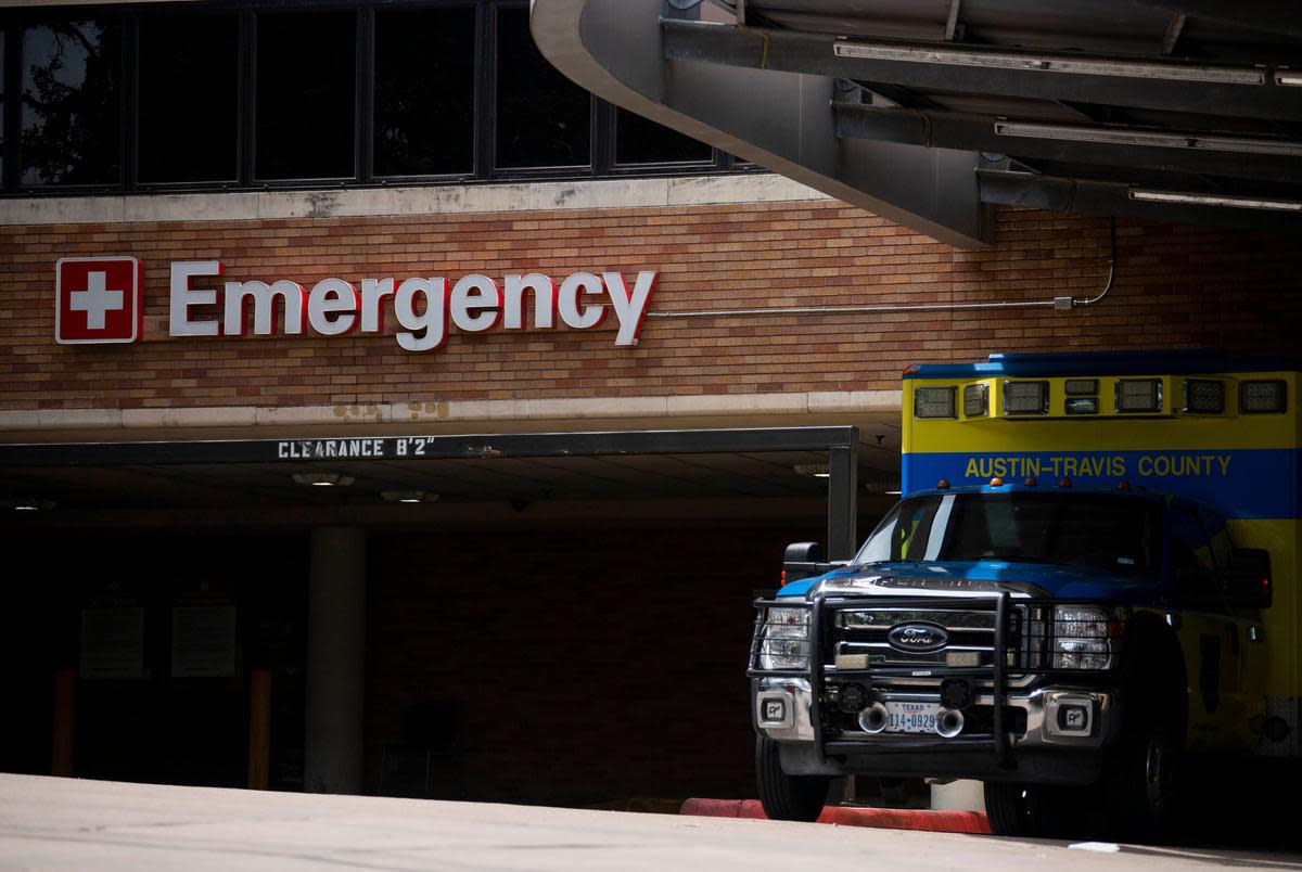 An Austin-Travis County EMS unit parked near a hospital's emergency entrance in Austin on July 7, 2020.