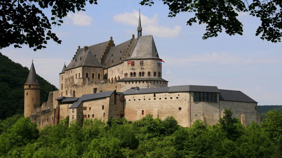 unverified content vianden castle, located in vianden in the north of luxembourg, is one of the largest fortified castles west of the rhine with origins dating from the 10th century, the castle was built in the romanesque style from the 11th to 14th centuries gothic transformations were added at the end of this period the castle fell to ruins in the 19th century but it has now been fully restored and is open to visitors