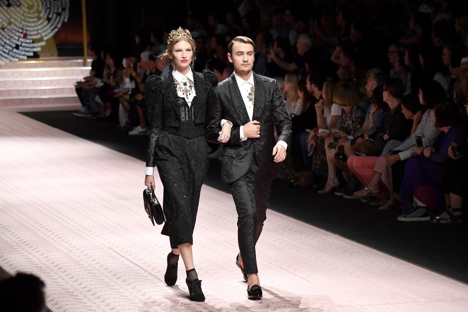 Liz Kennedy and Brandon Thomas Lee walk the runway at the Dolce & Gabbana show during Milan Fashion Week Spring/Summer 2019 on September 23, 2018 in Milan, Italy.