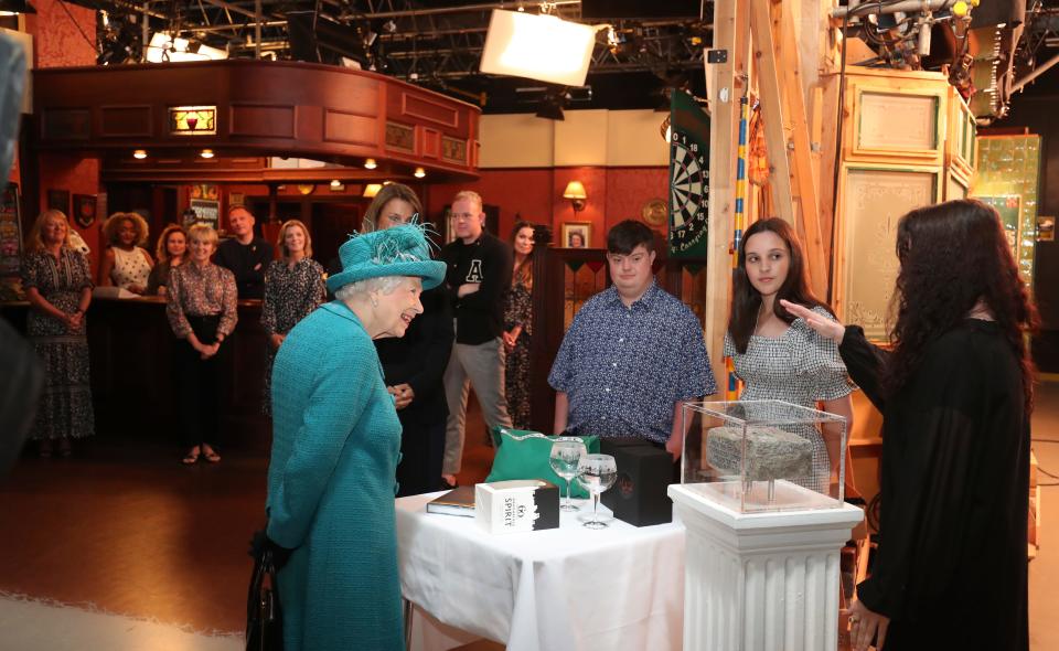 The queen met actors and crew during a visit to the set of long-running TV series "Coronation Street," including popping into the set's Rovers Return pub, on July 8, 2021 in Manchester.