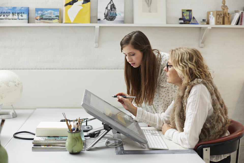 People working in small victorian style creative office