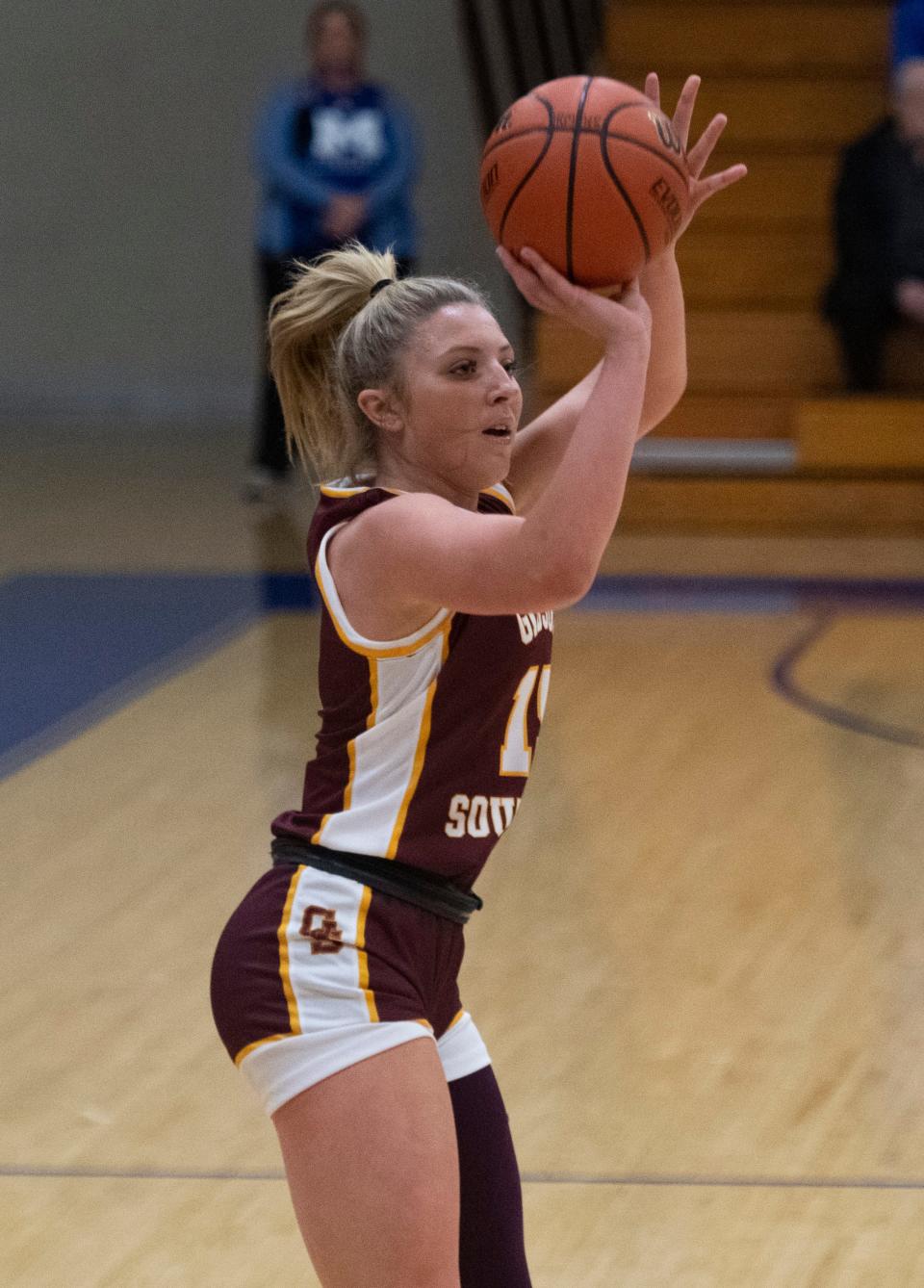 Gibson Southern’s Gabby Spink (15) takes a three-point shot as the Gibson Southern Titans play the Memorial Tigers in Evansville, Ind., Tuesday, Dec. 5, 2023.