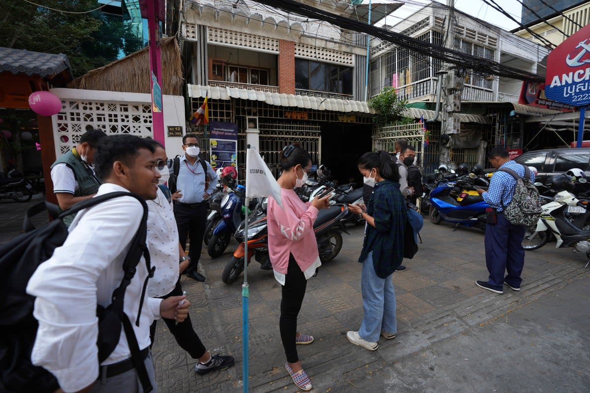 Journalists gather in front of the Voice of Democracy (VOD) office in Phnom Penh Cambodia on Monday, 13 February 2023 (Associated Press)