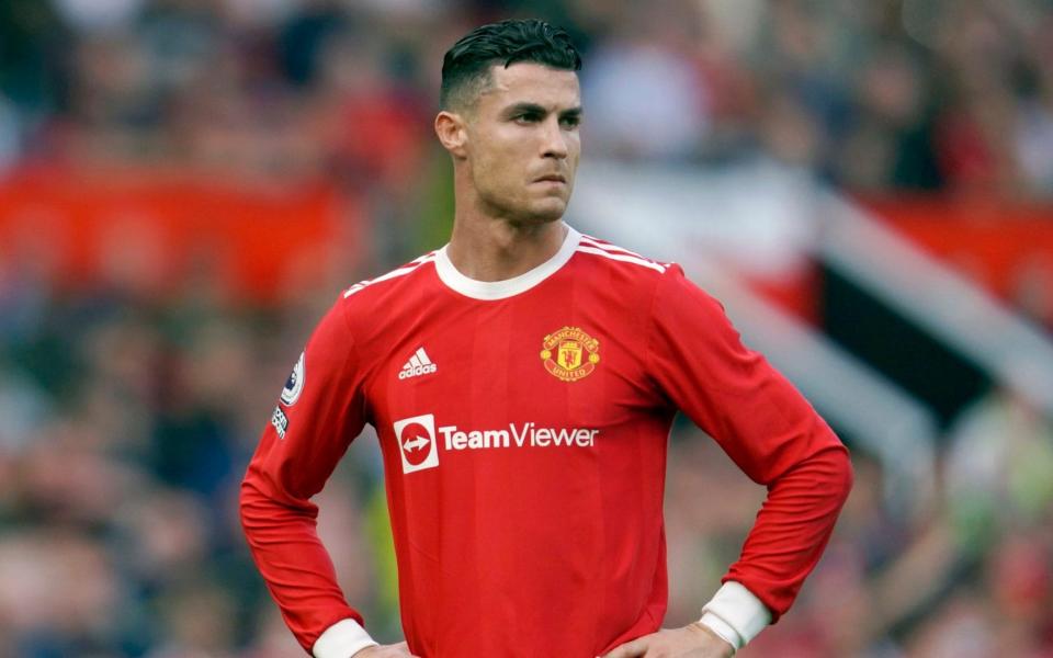 Manchester United's Cristiano Ronaldo stands on the pitch during the English Premier League soccer match between Manchester United and Norwich City at Old Trafford stadium in Manchester, England, on April 16, 2022. - AP