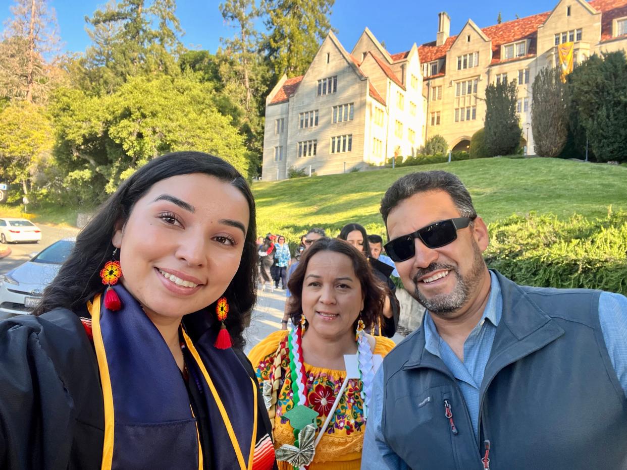 Yanelit Madriz Zarate takes a selfie with her parents on May 12, 2024, her commencement day at University of California, Berkeley.