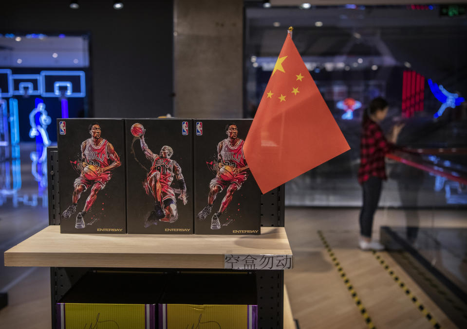 BEIJING, CHINA - OCTOBER 09: A Chinese flag is seen placed on merchandise in the NBA flagship retail store on October 9, 2019 in Beijing, China. The NBA is trying to salvage its brand in China amid criticism of its handling of a controversial tweet that infuriated the government and has jeopardized the leagues Chinese expansion. The crisis, triggered by a Houston Rockets executives tweet that praised protests in Hong Kong, prompted the Chinese Basketball Association to suspend its partnership with the league. The backlash continued with state-owned television CCTV scrapping its plans to broadcast pre-season games in Shanghai and Shenzhen, and the cancellation of other promotional fan events.  The league issued an apology, though NBA Commissioner Adam Silver angered Chinese officials further when he defended the right of players and team executives to free speech. China represents a lucrative market for the NBA, which stands to lose millions of dollars in revenue and threatens to alienate Chinese fans.  Many have taken to Chinas social media platforms to express their outrage and disappointment that the NBA would question the countrys sovereignty over Hong Kong which has been mired in anti-government protests since June.(Photo by Kevin Frayer/Getty Images)