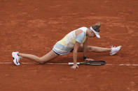 Amanda Anisimova of the U.S. falls as she plays Karolina Muchova of the Czech Republic during their third round match of the French Open tennis tournament at the Roland Garros stadium Friday, May 27, 2022 in Paris. (AP Photo/Christophe Ena)