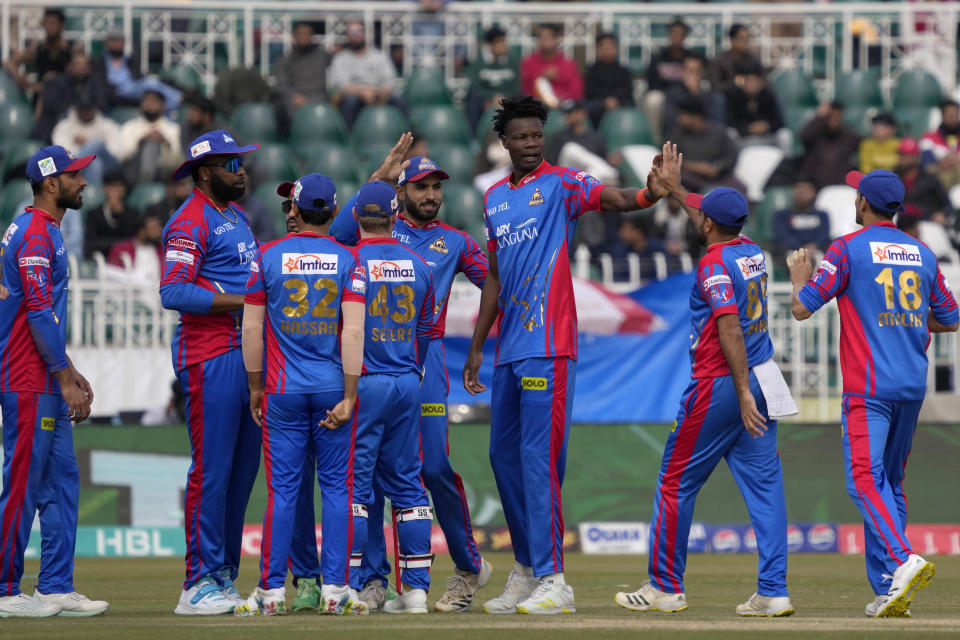 Karachi Kings' Blessing Muzarabani, third right, celebrates with teammates after taking the wicket during the Pakistan Super League T20 cricket match between Karachi Kings and Quetta Gladiators, in Rawalpindi, Pakistan, Wednesday, March 6, 2024. (AP Photo/Anjum Naveed)