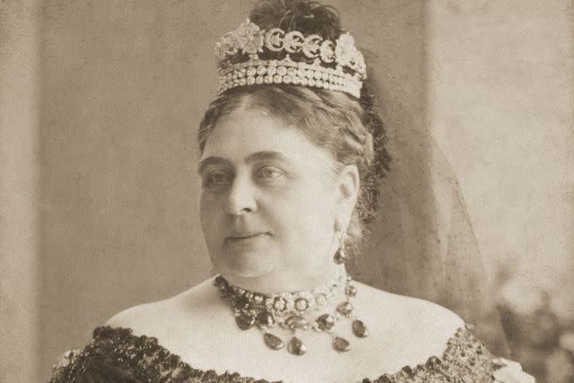 <p>Hulton Archive/Getty</p> Princess Mary Adelaide, Duchess of Teck, wears the Teck Crescent Tiara.