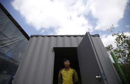 North Korean defector Lee Min-bok poses for photographs during an interview with Reuters at his home in Pocheon, about 15 km (9 miles) south of the demilitarized zone separating the two Koreas, October 15, 2014. REUTERS/Kim Hong-Ji