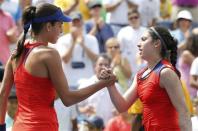 Ana Ivanovic (L) of Serbia is congratulated by Christina McHale of the U.S. after her victory at the U.S. Open tennis championships in New York August 31, 2013. REUTERS/Ray Stubblebine