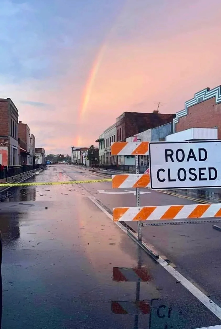 A rainbow appeared over the battered downtown as the press conference ended.