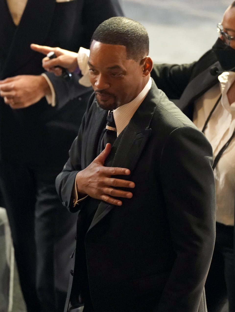 Will Smith appears in the audience at the Oscars on Sunday, March 27, 2022, at the Dolby Theatre in Los Angeles. (AP Photo/Chris Pizzello)