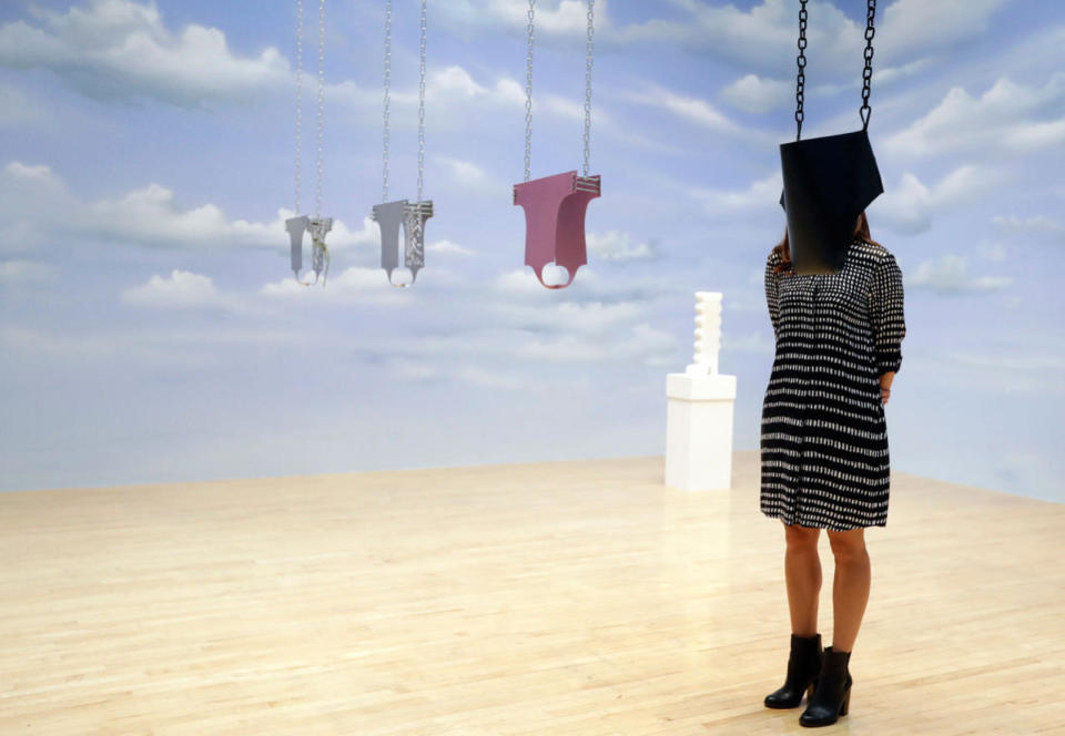 <p>A woman looks toward part of an artwork called ‘Lichen! Libido! (London!) Chastity!’ by Anthea Hamilton, one of the four artists shortlisted for the Turner Prize 2016, as it is displayed at the Tate Gallery in London, Sept. 26, 2016. (AP Photo/Kirsty Wigglesworth)</p>