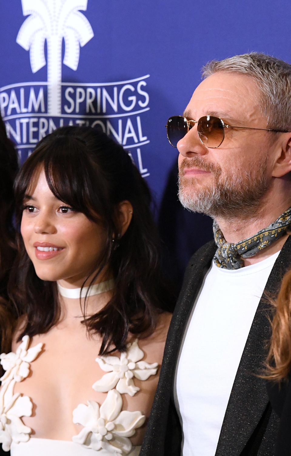 Closeup of Jenna Ortega and Martin Freeman on the red carpet