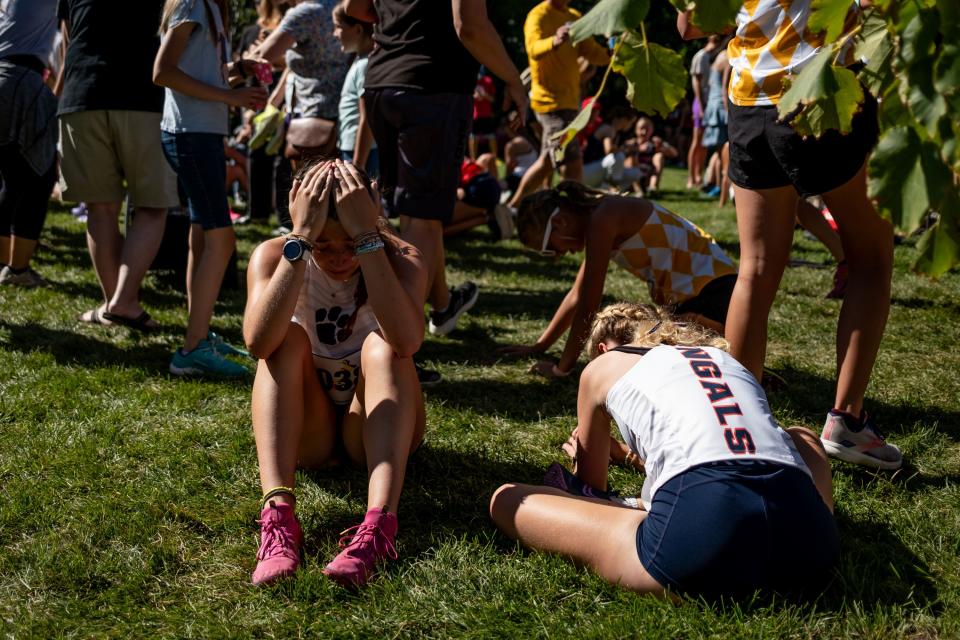 Runners recover from the championship girls race at the Border Wars XC meet at Sugar House Park in Salt Lake City on Saturday, Sept. 16, 2023. | Spenser Heaps, Deseret News