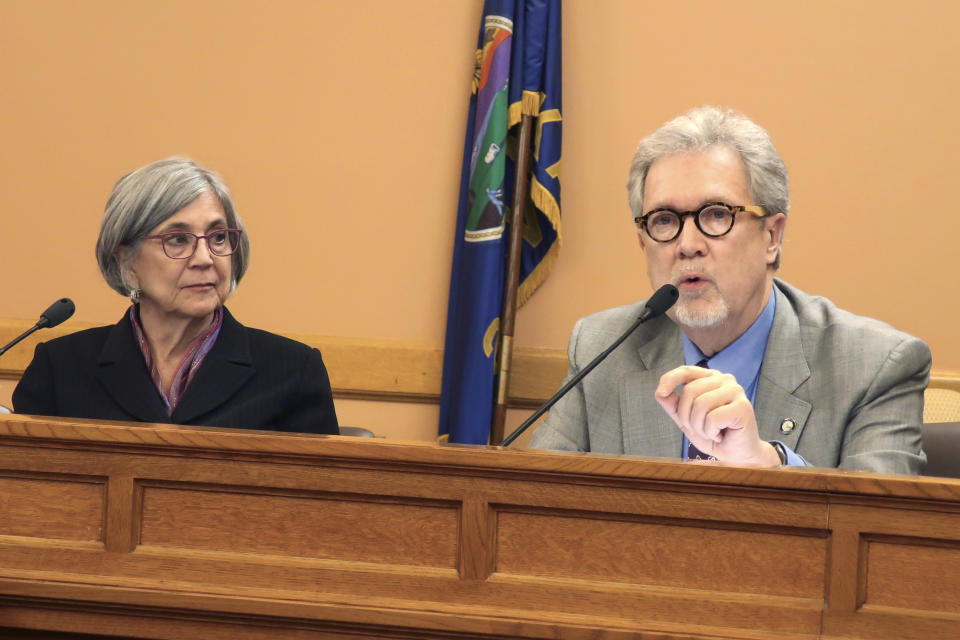 Kansas state Sen. Eric Rucker, right, R-Topeka, makes a point during a meeting of GOP senators about a proposed amendment to the state constitution on abortion, Wednesday, Jan. 29, 2020, at the Statehouse in Topeka, Kan. Watching Rucker is Senate President Susan Wagle, R-Wichita, and both support the measure, which would overturn a Kansas Supreme Court decision protecting abortion rights. (AP Photo/John Hanna)