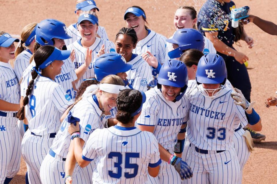 Kentucky’s players celebrate their walk-off win against Michigan in their NCAA Tournament opener against Michigan on Friday.