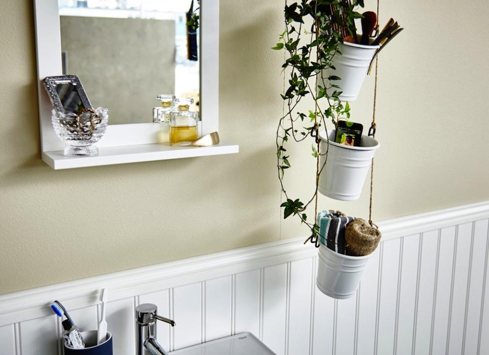 <body> <p>This rustic hanging storage unit creates the illusion of shelves without occupying any wall space, and gives a small bath the illusion of height. If you’re hooked on the idea, secure <a rel="nofollow noopener" href=" http://www.bobvila.com/slideshow/18-brilliant-ways-to-decorate-with-rope-45768#.VrJWkWTysy4?bv=yahoo" target="_blank" data-ylk="slk:rope;elm:context_link;itc:0;sec:content-canvas" class="link ">rope</a> to the ceiling with an S-hook, and then in tiers, intertwine kitchen utensil holders, wicker baskets, or plant pots to keep clutter tied up.</p> <p><strong>Related: <a rel="nofollow noopener" href=" http://www.bobvila.com/slideshow/the-10-best-plants-for-your-bathroom-48568?bv=yahoo" target="_blank" data-ylk="slk:The 10 Best Plants for Your Bathroom;elm:context_link;itc:0;sec:content-canvas" class="link ">The 10 Best Plants for Your Bathroom</a> </strong> </p> </body>