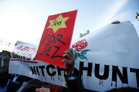 Supporters of Britain's opposition Labour Party attend a demonstration organised by the British Board of Jewish Deputies for those who oppose anti-Semitism, in Parliament Square in London, Britain, March 26, 2018. REUTERS/Henry Nicholls