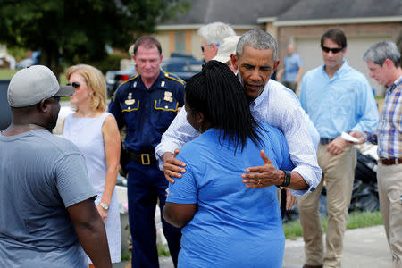 U.S. President Barack Obama tours a flood-affected neighborhood in Zachary, Louisiana, U.S., August 23, 2016. REUTERS/Jonathan Ernst