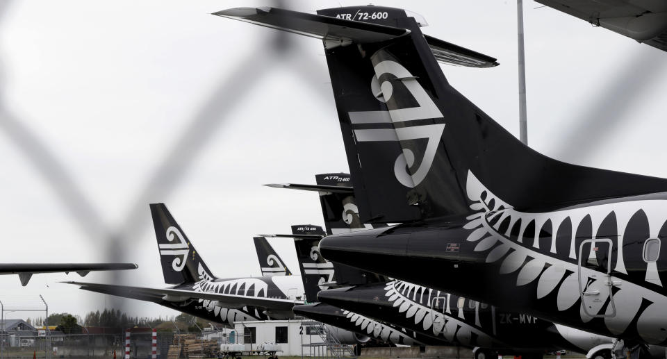 In this April 6, 2020 file photo Air New Zealand planes sit idle on the tarmac at Christchurch Airport, New Zealand. An expert group advising the government believes it is realistic for the country to maintain its zero-tolerance approach, which has included strict lockdowns for even small outbreaks, once it begins to reopen its borders. Source: AAP