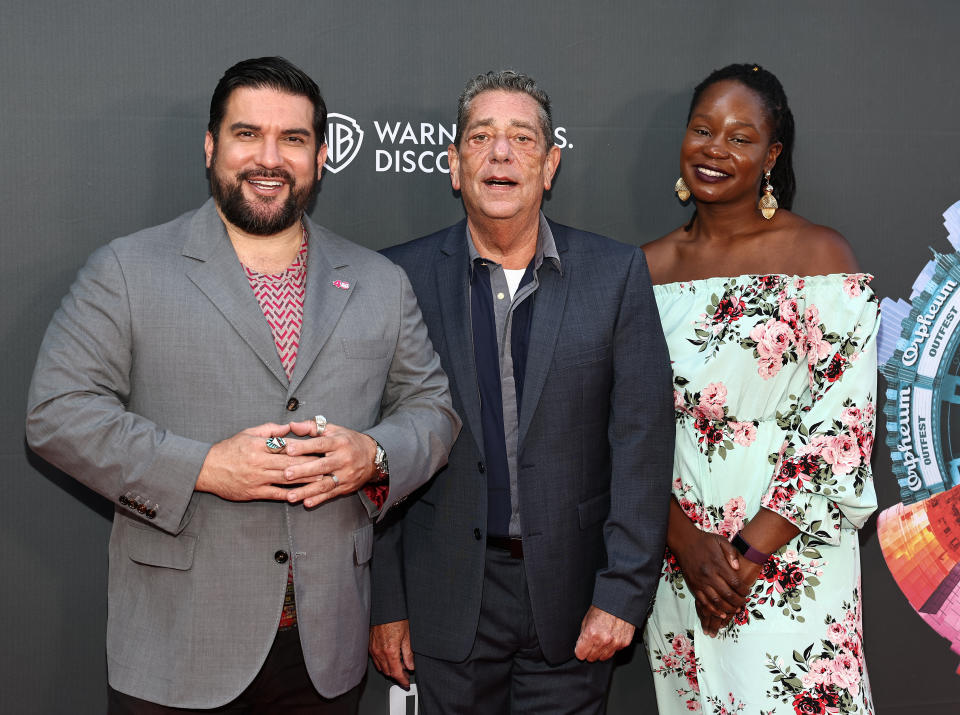 From left, Outfest executive director Damien S. Navarro, former fest director Larry Horne, Outfest artistic director Faridah Gbadamosi on opening night. - Credit: Shutterstock for Outfest