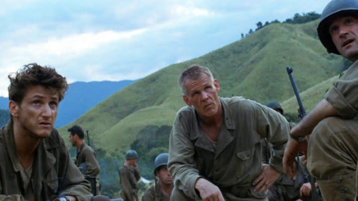 Sean Penn, Nick Nolte, and Elias Koteas sit and look in The Thin Red Line.