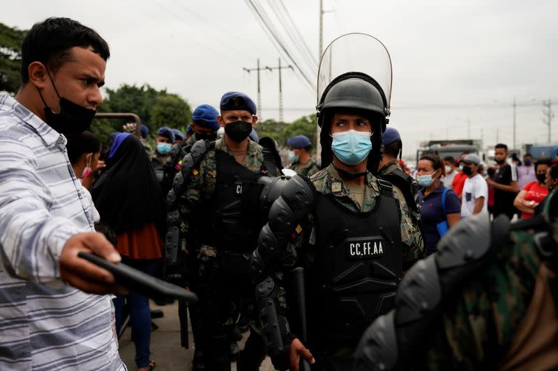 Soldiers stand guard following a deadly prison riot, in Guayaquil