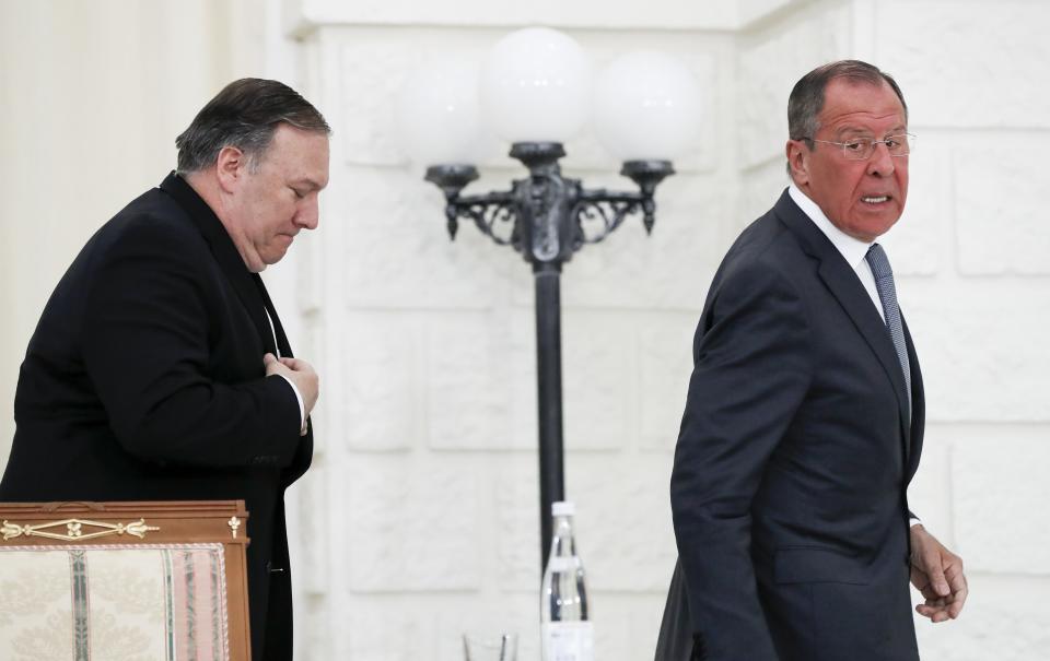 U.S. Secretary of State Mike Pompeo, left, and Russian Foreign Minister Sergey Lavrov leave their joint news conference following the talks in the Black Sea resort city of Sochi, southern Russia, Tuesday, May 14, 2019. Pompeo's first trip to Russia starts Tuesday in Sochi, where he and Russian Foreign Minister Sergey Lavrov are sitting down for talks and then having a joint meeting with President Vladimir Putin. (AP Photo/Pavel Golovkin, Pool)