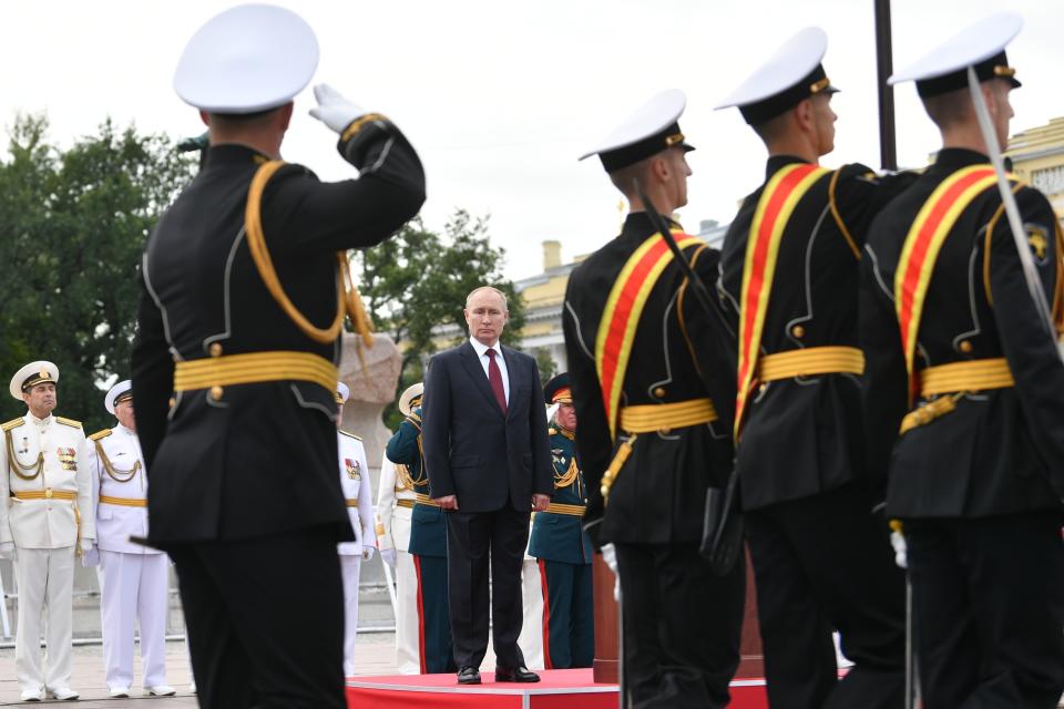 Russian President Vladimir Putin, center, attends the Navy Day parade in St.Petersburg, Russia, Sunday, July 25, 2021. (Alexei Nikolsky, Sputnik, Kremlin Pool Photo via AP)