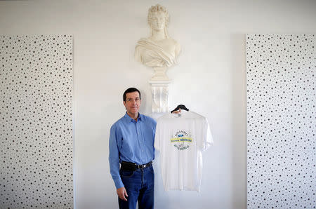 Elected French official Maurice Ciron poses with a T-shirt which reads "Doctors Wanted" at the city hall in Entrammes, near Laval, France, November 8, 2018. Picture taken November 8, 2018. REUTERS/Stephane Mahe