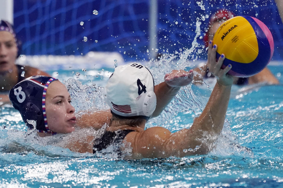 Anastasia Simanovich (8), of the Russian Olympic Committee, pressures United States' Rachel Fattal (4) during a preliminary round women's water polo match at the 2020 Summer Olympics, Friday, July 30, 2021, in Tokyo, Japan. (AP Photo/Mark Humphrey)