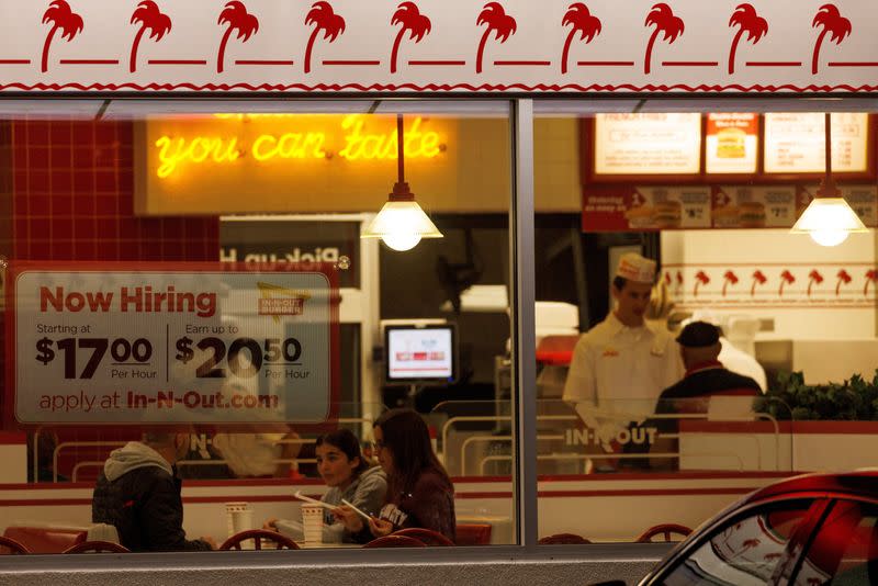 FILE PHOTO: "Now hiring" sign displayed at a fast food restaurant in California