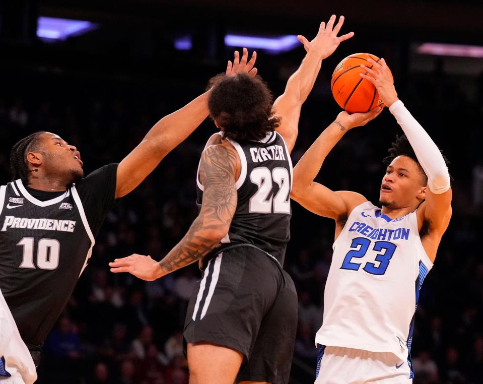 Creighton guard Trey Alexander shoots over Providence forward Rich Barron and guard Devin Carter (22) during the Big East Tournament, March 14, 2024.