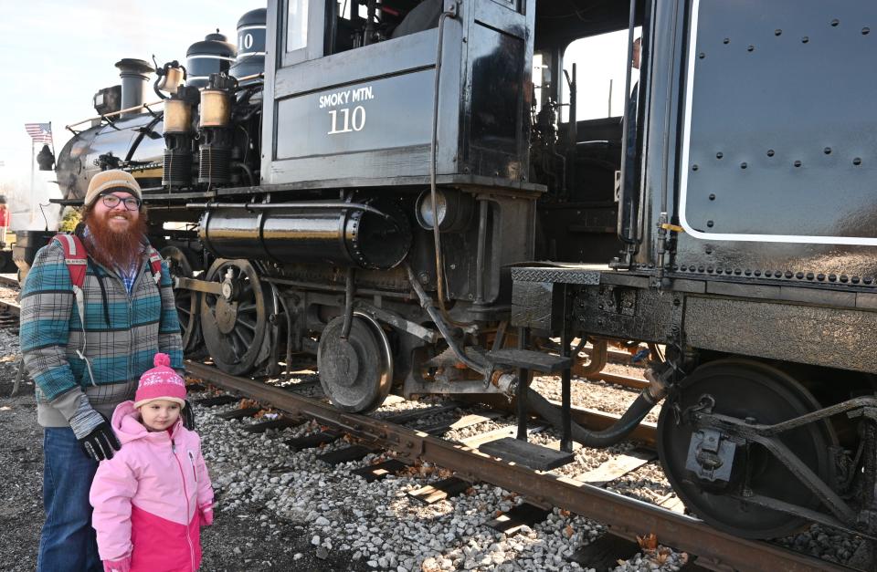 Hallie Ray and her dad Matthew came to look at Engine 110 before their trip on the Little River Railroad Holiday Express last year.