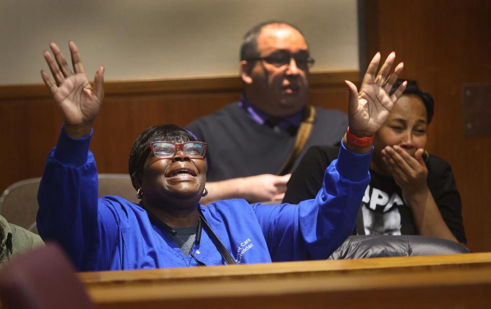 Petronia Rhynes,(left) sister of Michael Rhynes and Michelle Miller, his daughter breakdown in court after hearing that Michael had his double murder conviction vacated celebrates after leaving the courtroom.