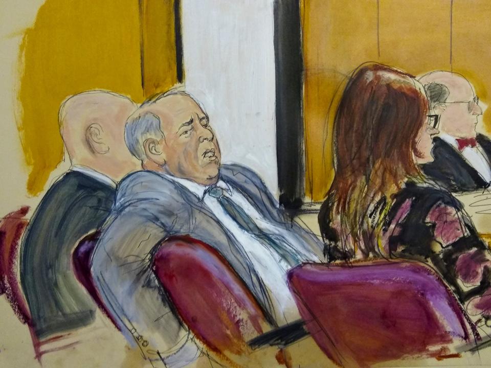 In this courtroom sketch, Harvey Weinstein sits in a Manhattan court room as the judge instructs the jurors before they begin deliberating on charges he faces in his sex-crimes trial, Feb. 18, 2020, in New York.