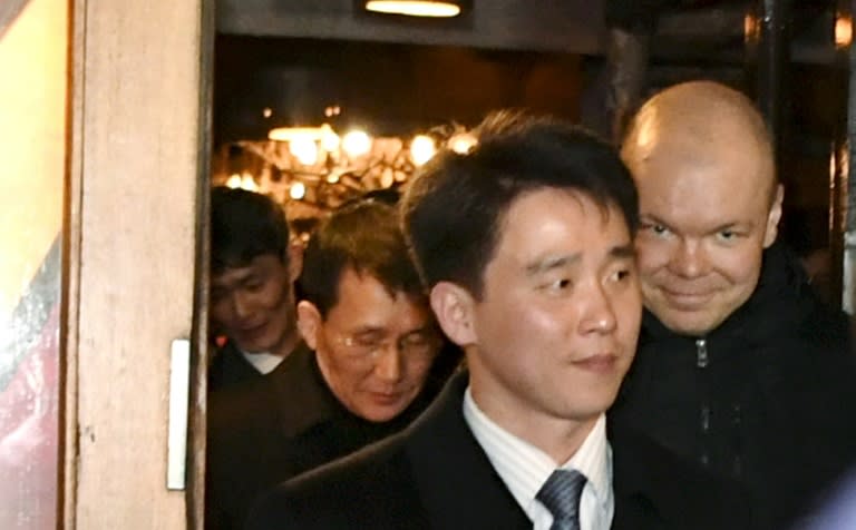 Senior North Korean diplomat Choe Kang Il (in background) emerges from a restaurant in Helsinki, part of intense diplomacy over the Korean peninsula