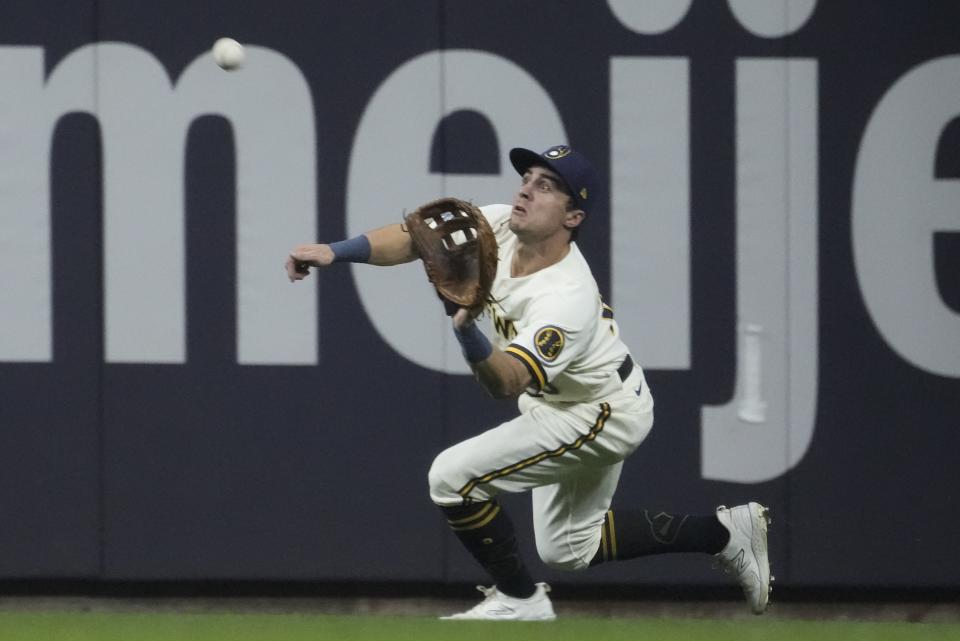 Milwaukee Brewers' Sal Frelick makes a running catch on a ball hit by St. Louis Cardinals' Paul Goldschmidt during the fourth inning of a baseball game Tuesday, Sept. 26, 2023, in Milwaukee. (AP Photo/Morry Gash)
