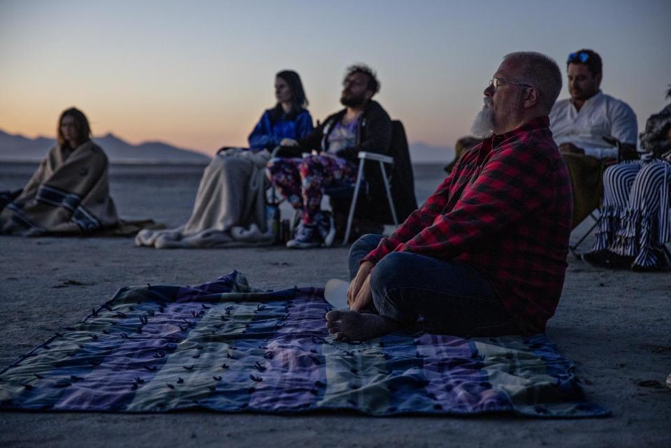 Urquhart and with fellow Divine Assembly members at the Great Salt Lake in June. The church’s website says the only requirements to join are “sincere belief in your ability to commune with the Divine; strict adherence to the law and safety protocols; and a sincere effort to respect yourself, others, and the Divine.” - Credit: Kim Raff for Rolling Stone