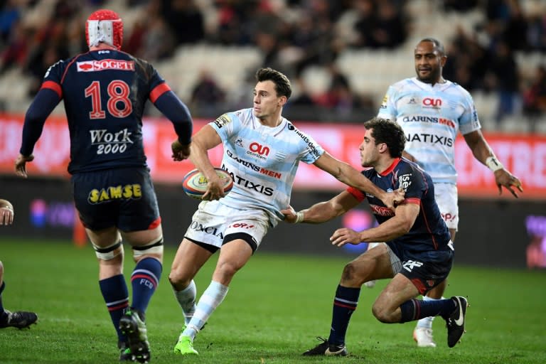 Racing's winger Juan Imhoff (C) runs with the ball during the French Top 14 rugby union match against Grenoble March 4, 2017