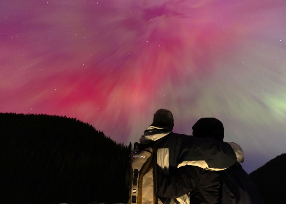 MANNING PARK, BRITISH COLUMBIA - MAY 11: A couple watch the aurora borealis, commonly known as the northern lights on May 11, 2024 in Manning Park, British Columbia, Canada. (Photo by Andrew Chin/Getty Images)