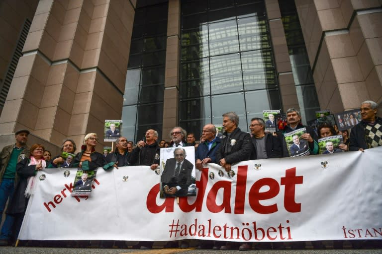 Journalists gathered outside the Istanbul court this week with a banner reading "Justice" and waving pictures of the Cumhuriyet newspaper's chairman Akin Atalay who has spent 500 days behind bars